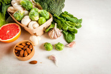 Selection of products to enhance the health and immunity: broccoli, mushrooms, mushrooms, Brussels sprouts, spinach, garlic, almonds and grapefruit, copy space