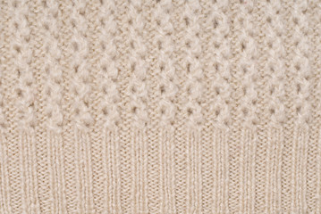 beige knitted background/ beige knitted background pattern closeup