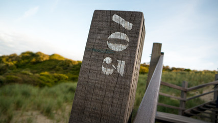 Wooden Pole with Number Seven Hundred Three