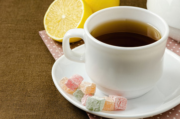 Turkish delight with tea on a saucer