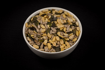 mixed seeds in wooden bowl