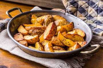 Potato. Roasted potatoes. American potatoes with salt pepper and cumin. Roasted potato wedges delicious crispy.