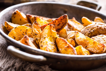 Potato. Roasted potatoes. American potatoes with salt pepper and cumin. Roasted potato wedges delicious crispy.