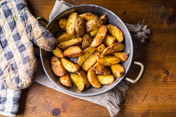 Potato. Roasted potatoes. American potatoes with salt pepper and cumin. Roasted potato wedges delicious crispy.