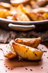 Potato. Roasted potatoes. American potatoes with salt pepper and cumin. Roasted potato wedges delicious crispy.
