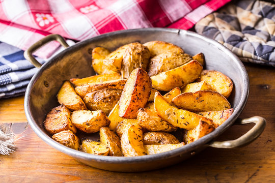 Potato. Roasted potatoes. American potatoes with salt pepper and cumin. Roasted potato wedges delicious crispy.