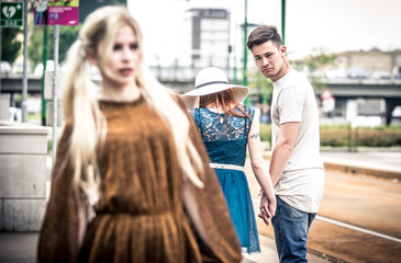 Man watching beautiful girl on the street