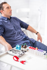Businessman waiting for blood collecting analysis