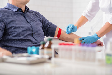 Professional doctor preparing patient for procedure