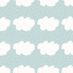 Seamless pattern with hand drawn clouds and dots on blue background.