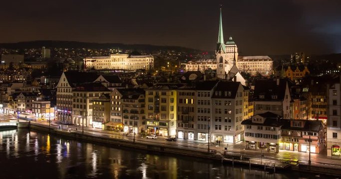 Zurich, Switzerland - view from Lindenhoefe over river Limmat and downtown Zurich with ETH of Zurich, University of Zurich and Rudolf-Brun-Bridge at night - Timelapse with zoom in - March 2016