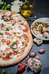 Seafood traditional pizza on thin crust