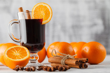 Mulled wine and spices closeup in glass cup. Homemade wine conce