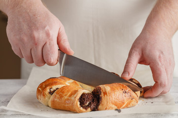 Fruit pie crust. Chef's hand cut with knife pie crust sliced on