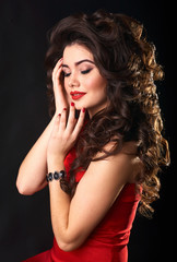 woman on a black background with beautiful hair. 