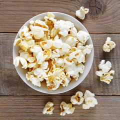 Popcorn close-up on wooden table top view