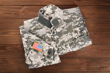 USA military uniform on wooden background