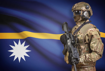 Soldier in helmet holding machine gun with flag on background series - Nauru