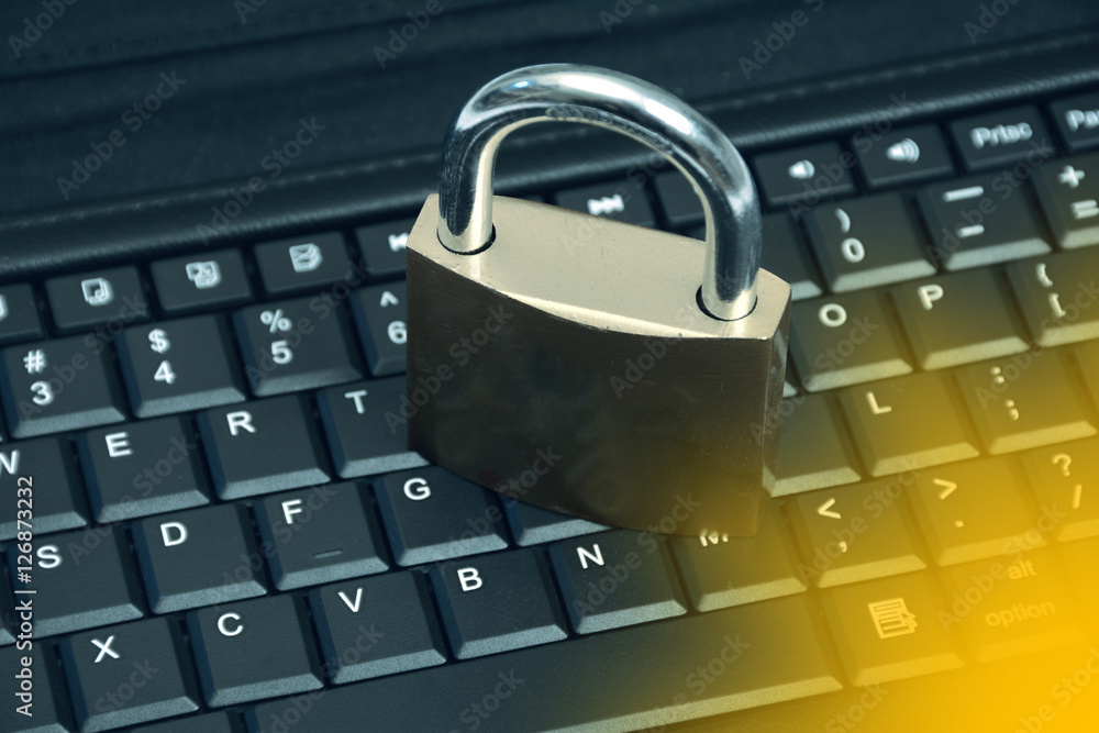 Poster data security encryption photo concept metallic padlock on laptop keyboard
