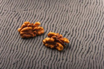Open nuts on striped background