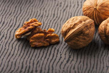 Open nuts on striped background