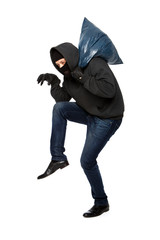 Robber sneaks in black mask