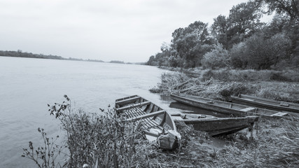 Old boats on the river bank