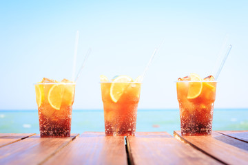 Concept of luxury tropical vacation. Three Cuba Libre cocktails