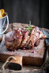 Homemade chips and steak with rosemary and salt