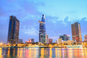Night view of Downtown center of Ho Chi Minh city on Saigon riverbank in twilight, Vietnam.
