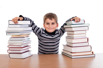 Schoolboy and a heap of books