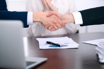 Business people shaking hands finishing up a meeting
