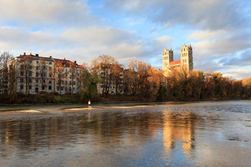 Fototapeta na wymiar Munich, Sankt Maximilian church on Isar river bank in autumn. 