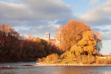 Munich, Sankt Maximilian church on Isar river bank in autumn. 