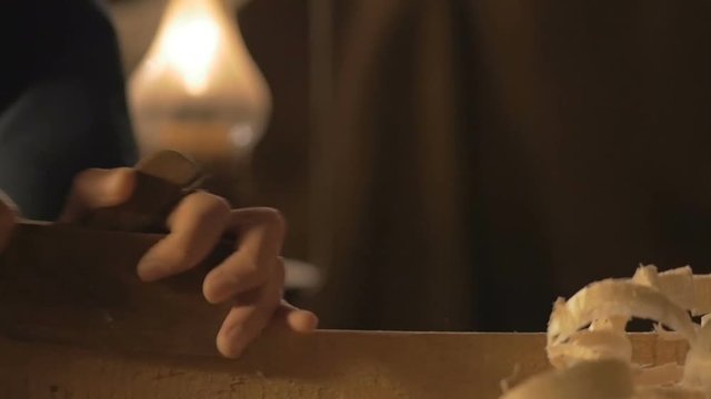 master carpenter makes basting on the Board with a pencil, draws, craftsman work tool in the workshop.