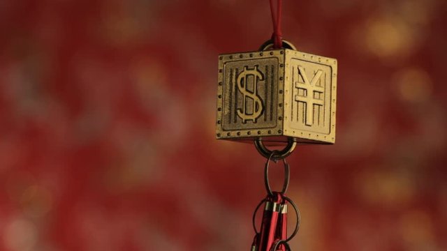 CU Hanging decoration depicting Yen and Dollar signs