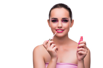 Woman applying lipstick isolated on white