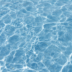 Surface of swimming pool water background
