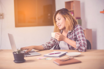 business woman writing something on notepad in office.