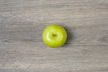 Apple on wooden table