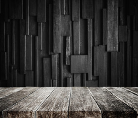 Wood planks tabletop with dark wood background