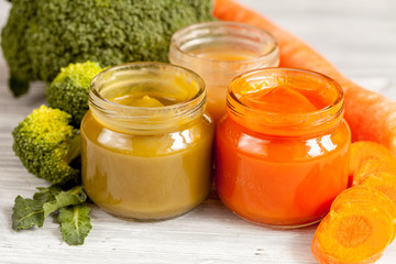 baby vegetable puree on wooden background