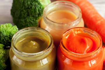baby vegetable puree on wooden background