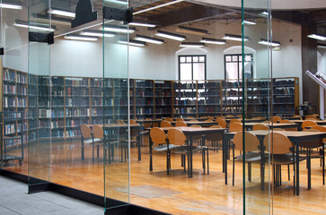 modern library: empty reading room with tables