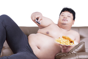 Fat man watch tv on sofa