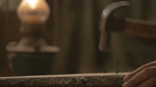 master carpenter makes basting on the Board with a pencil, draws, craftsman work tool in the workshop.
