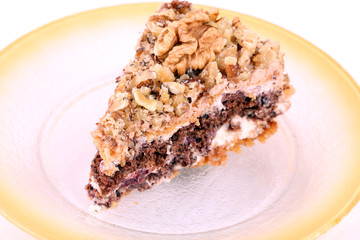 portion of white and brown chocolate walnut cake with walnuts