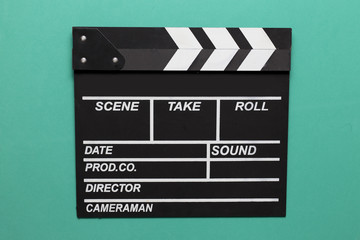 Obraz premium movie clapper on green background