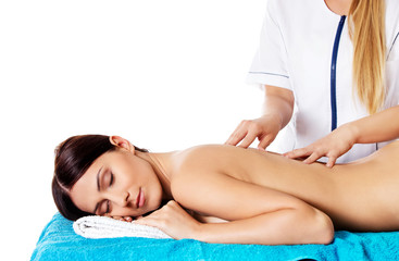 Obraz premium Woman having massage of body in the spa salon. Beauty treatment concept.