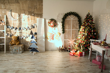Interior of the room with the Christmas spruce,